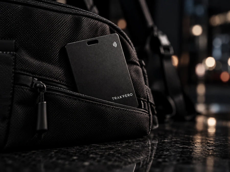 TRAKVERO card in a black bag pocket at night