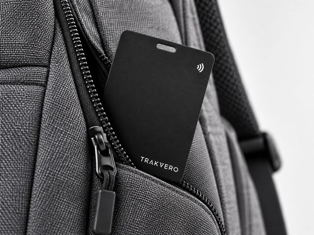 TRAKVERO card tucked in a grey backpack pocket